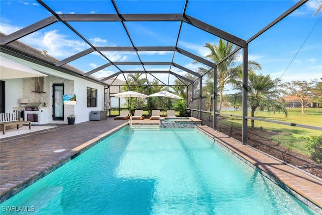 view of pool featuring an in ground hot tub, a patio, and a lanai