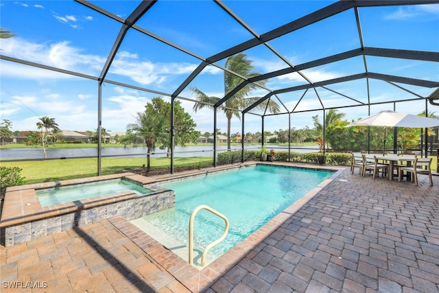 view of pool featuring a patio, a lanai, an in ground hot tub, and a water view