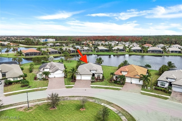 birds eye view of property with a water view