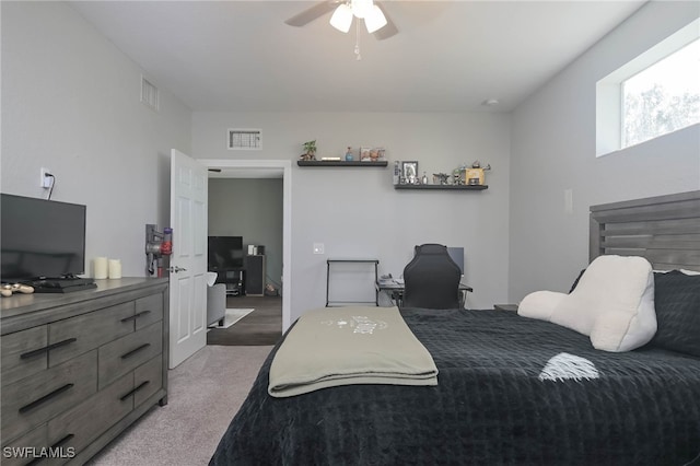 bedroom with ceiling fan and carpet flooring