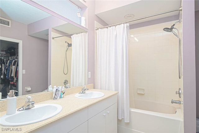 bathroom with vanity and shower / bath combo with shower curtain