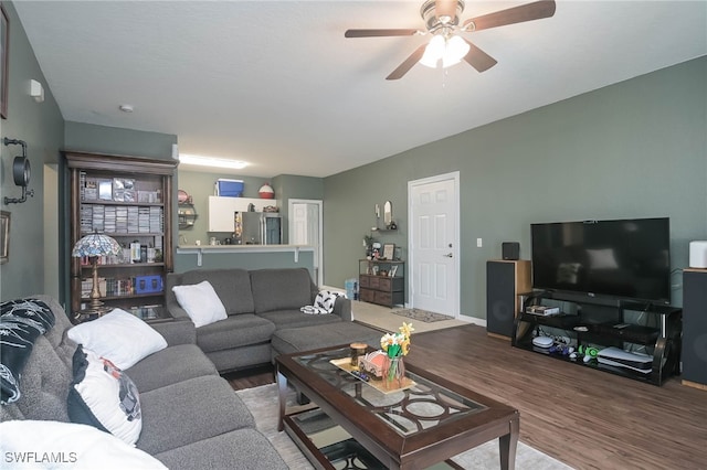 living room with hardwood / wood-style flooring and ceiling fan