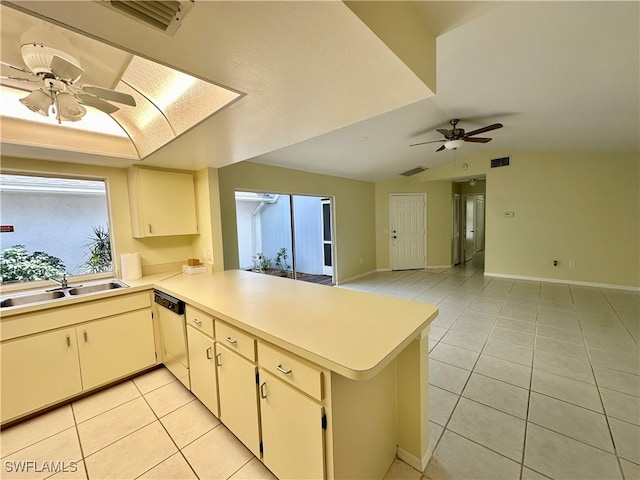 kitchen with kitchen peninsula, ceiling fan, dishwasher, light tile patterned flooring, and sink