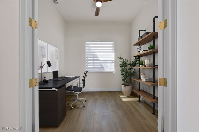 home office with hardwood / wood-style flooring and ceiling fan