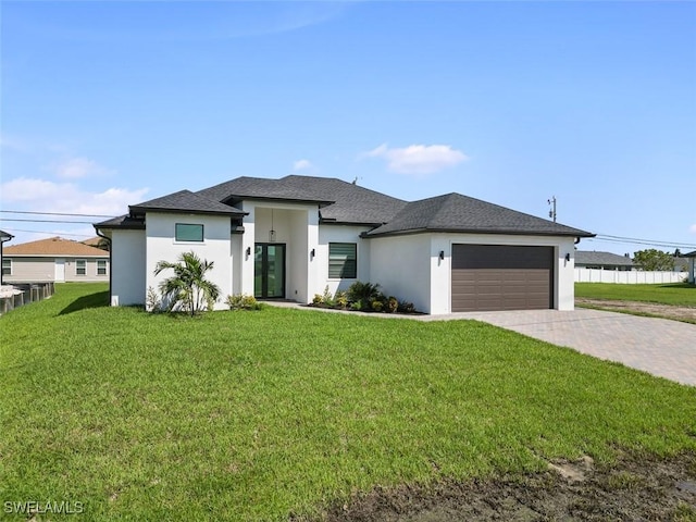 209 Kismet Pkwy E, Cape Coral, FL 33909 - prairie-style house featuring a garage, stucco siding, driveway, and a front yard