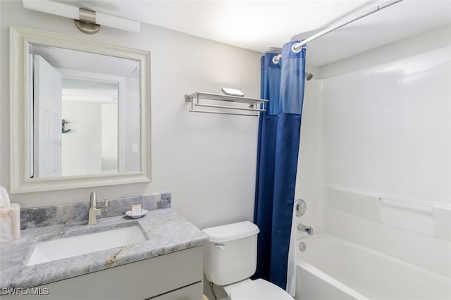 full bathroom with vanity, shower / bath combination with curtain, and toilet