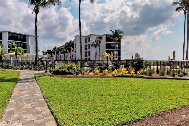 view of home's community featuring a lawn