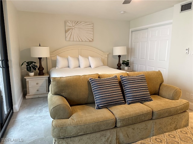 bedroom featuring concrete floors, a closet, and ceiling fan