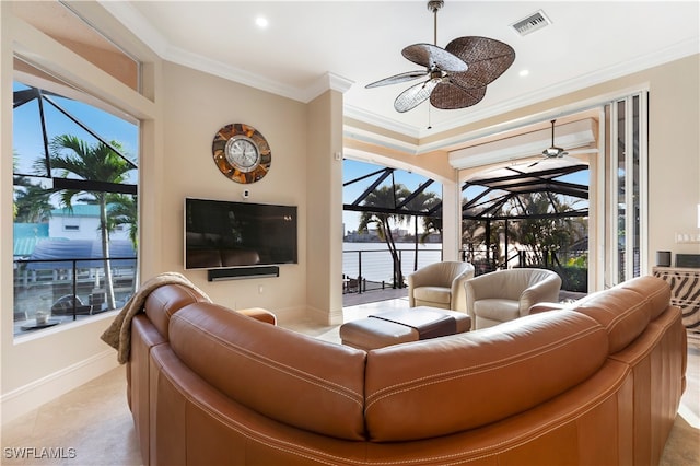 tiled living room with a wealth of natural light and crown molding