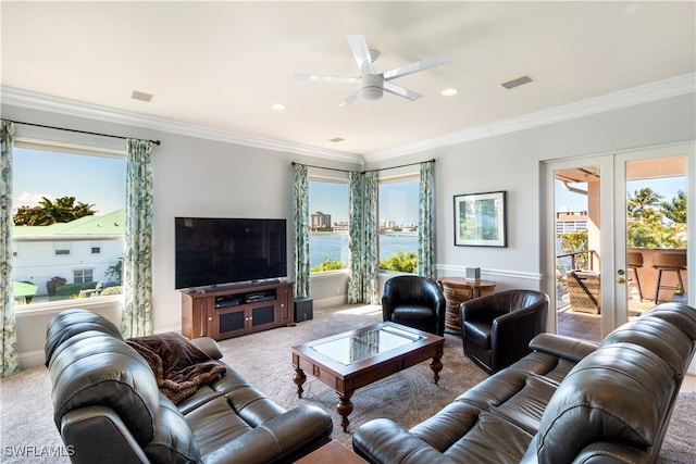 living room featuring a wealth of natural light, ornamental molding, french doors, and ceiling fan