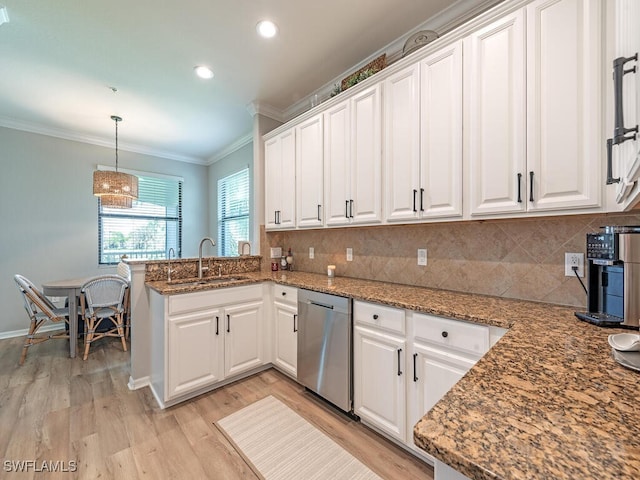 kitchen featuring white cabinetry, dishwasher, sink, light hardwood / wood-style flooring, and kitchen peninsula