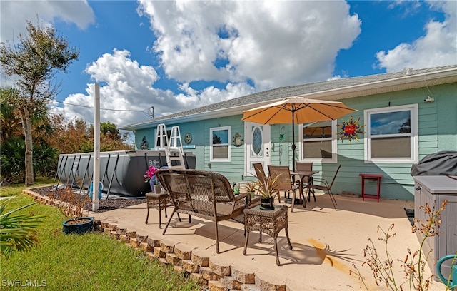 rear view of property with a patio area