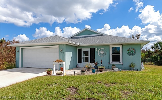 single story home with a front lawn and a garage