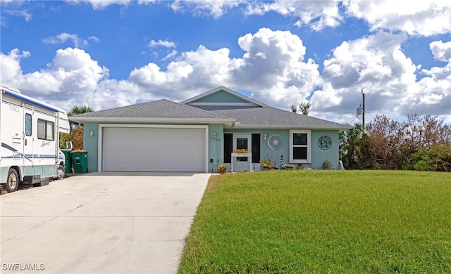 ranch-style home with a front yard and a garage