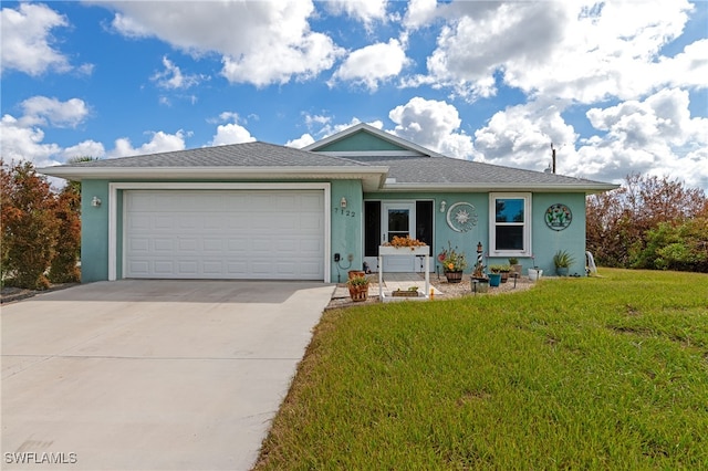 ranch-style home featuring a front yard and a garage