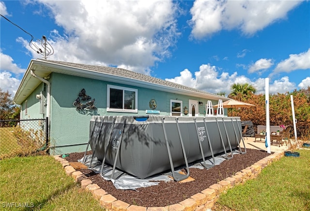 rear view of house featuring a patio