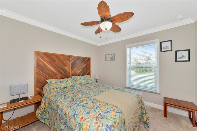 carpeted bedroom featuring ornamental molding and ceiling fan