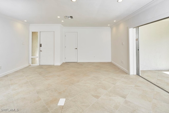 unfurnished room featuring crown molding