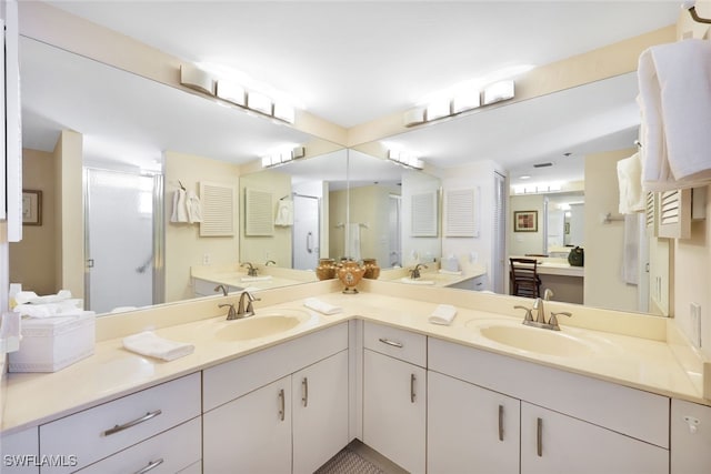 bathroom featuring walk in shower and vanity