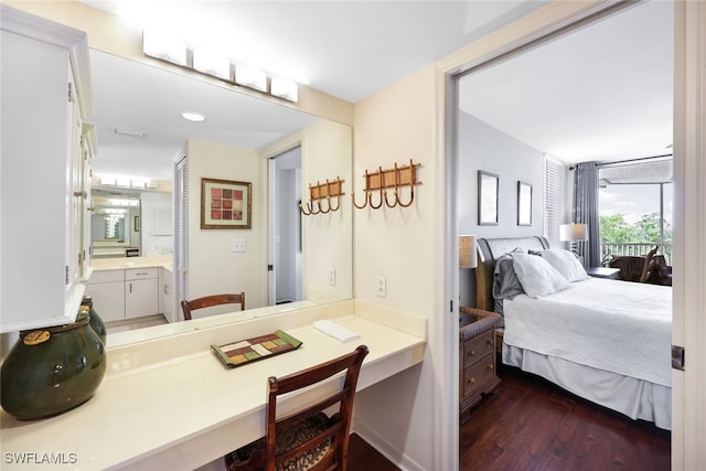 interior space with vanity and hardwood / wood-style floors