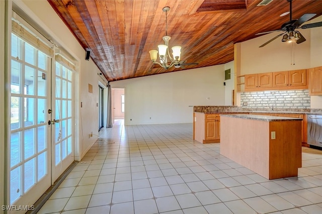 kitchen with light brown cabinetry, lofted ceiling, wood ceiling, and tasteful backsplash