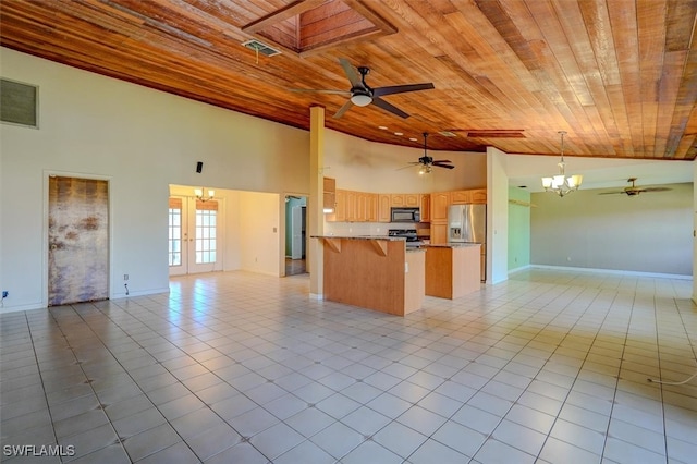 kitchen featuring appliances with stainless steel finishes, light tile patterned flooring, high vaulted ceiling, and wooden ceiling