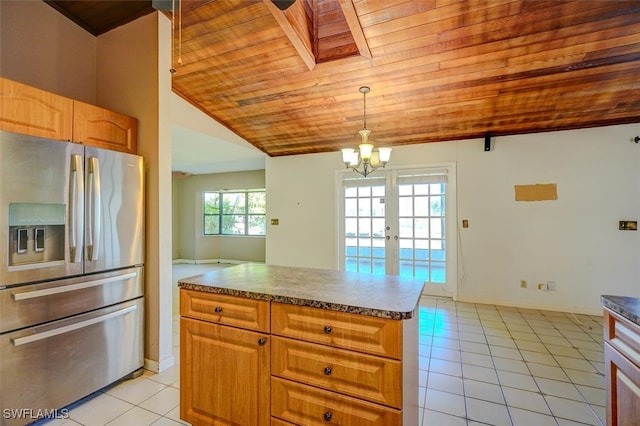 kitchen with stainless steel refrigerator with ice dispenser, wooden ceiling, pendant lighting, light tile patterned floors, and lofted ceiling with skylight