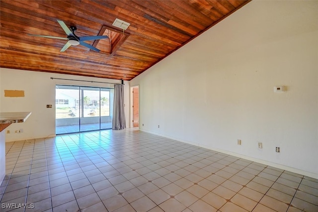 spare room featuring vaulted ceiling, ceiling fan, light tile patterned flooring, and wooden ceiling