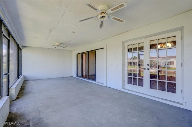 unfurnished sunroom with french doors and ceiling fan