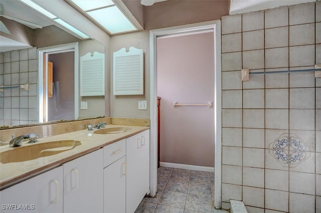 bathroom with vanity and tile patterned flooring