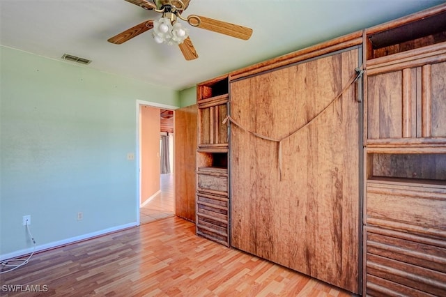 unfurnished bedroom with wood-type flooring and ceiling fan