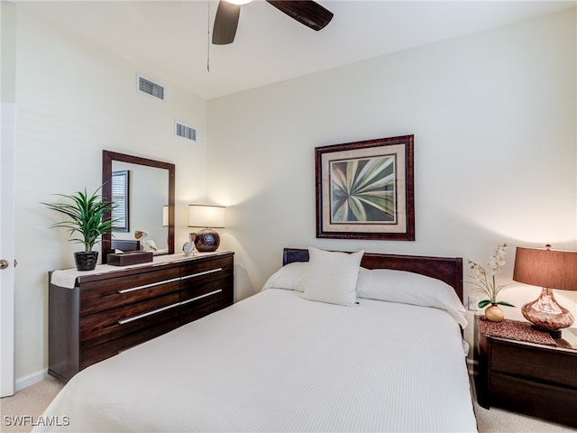 bedroom with light colored carpet and ceiling fan