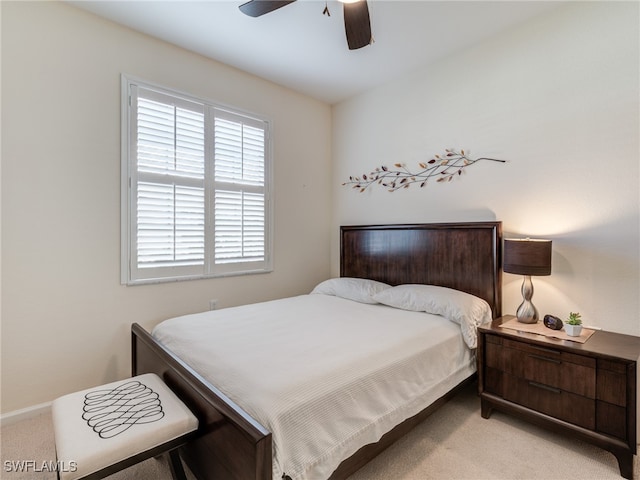 bedroom with light carpet and ceiling fan