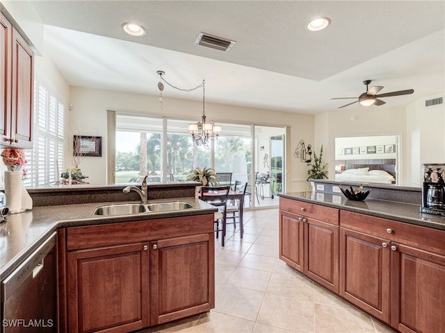 kitchen featuring sink, dishwasher, ceiling fan with notable chandelier, pendant lighting, and light tile patterned floors