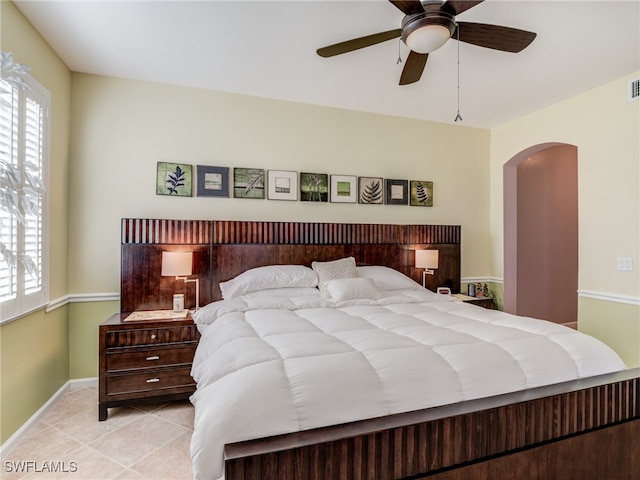 bedroom with light tile patterned floors and ceiling fan