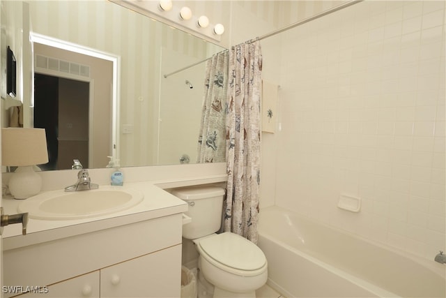 full bathroom featuring vanity, toilet, and shower / bathtub combination with curtain