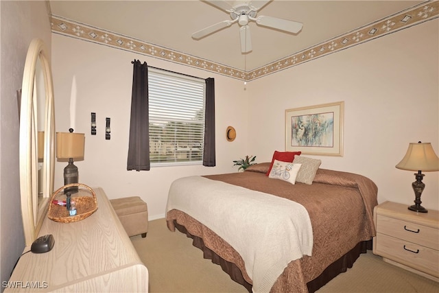 bedroom with light colored carpet and ceiling fan