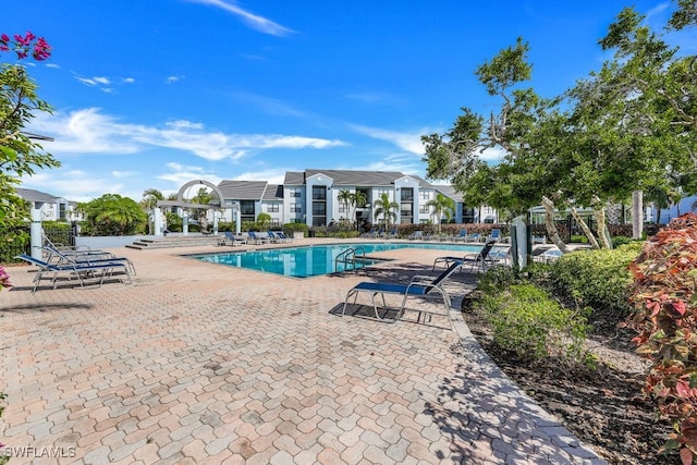 view of swimming pool featuring a patio