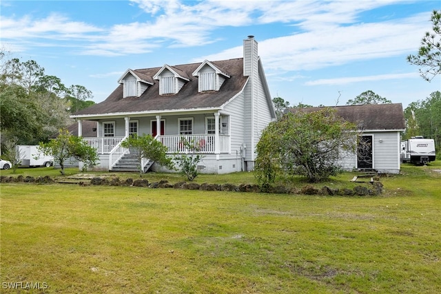 cape cod house featuring covered porch and a front yard