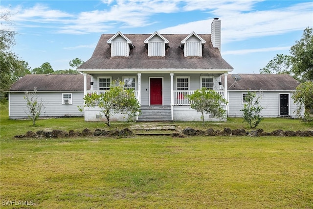 cape cod-style house featuring covered porch and a front lawn