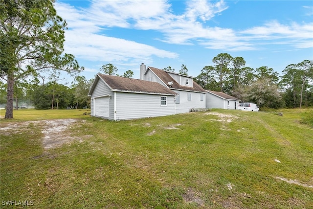 rear view of property with a lawn