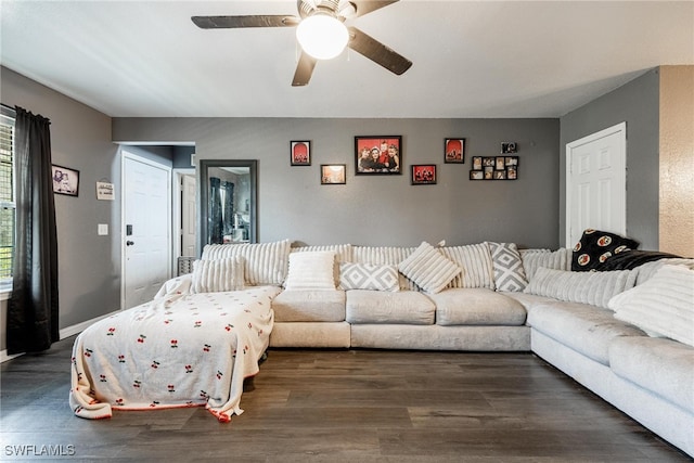 living room featuring dark hardwood / wood-style floors and ceiling fan