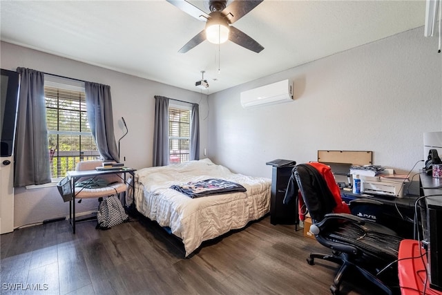 bedroom featuring dark wood-type flooring, a wall mounted air conditioner, multiple windows, and ceiling fan