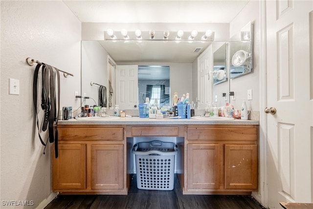 bathroom featuring vanity and hardwood / wood-style flooring