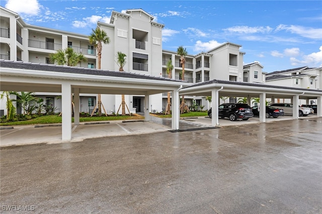 view of parking / parking lot with a carport