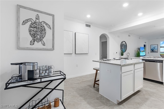 kitchen featuring dishwasher, crown molding, a center island, white cabinets, and light stone counters