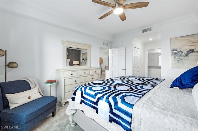 bedroom with connected bathroom, a closet, light carpet, ornamental molding, and ceiling fan