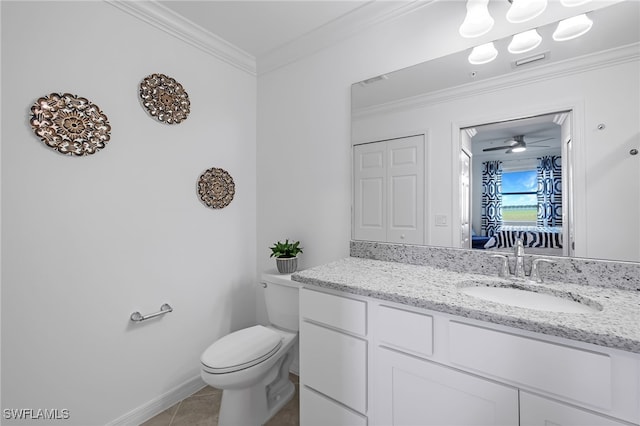 bathroom with toilet, ceiling fan, vanity, crown molding, and tile patterned flooring