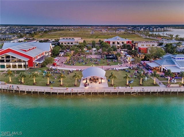 aerial view at dusk with a water view