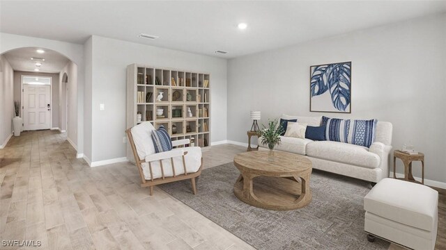 living room with light hardwood / wood-style flooring